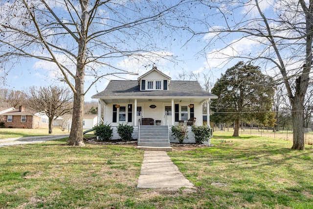 bungalow with a front lawn and a porch