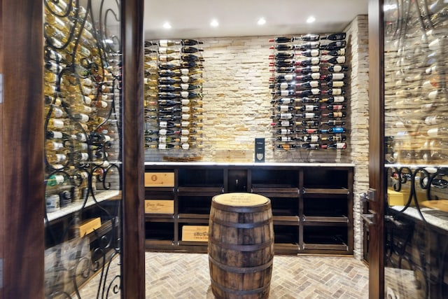 wine cellar with brick floor and recessed lighting