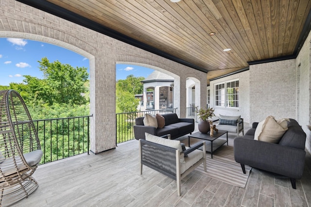 wooden deck featuring outdoor lounge area