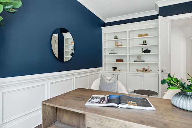 office area with crown molding and wainscoting