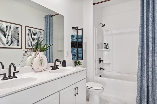 full bathroom with shower / tub combo with curtain, marble finish floor, a sink, and toilet