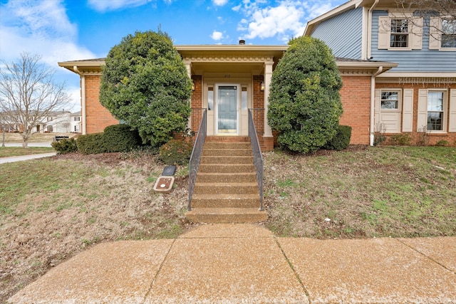 view of front of property featuring brick siding