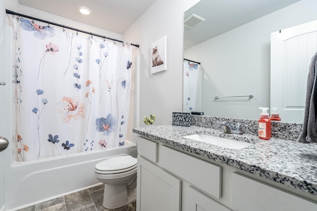 bathroom with toilet, shower / tub combo, vanity, visible vents, and stone finish floor