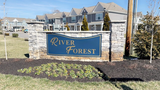 community / neighborhood sign featuring a residential view