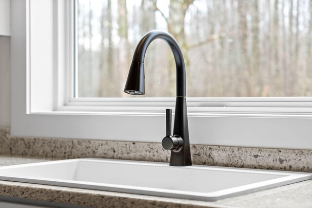 details with light countertops and a sink