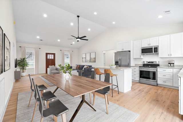 dining area with high vaulted ceiling, recessed lighting, a ceiling fan, visible vents, and light wood-type flooring