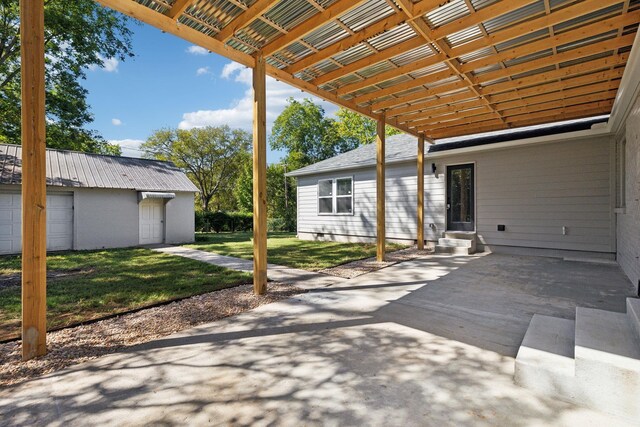 view of patio featuring a garage and entry steps