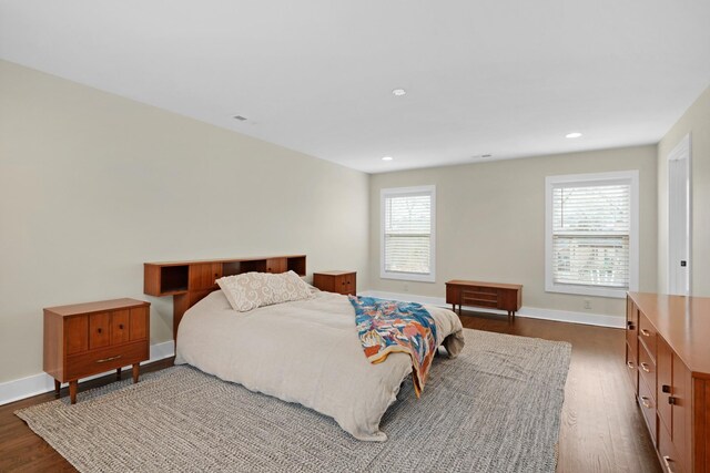 bedroom featuring recessed lighting, dark wood-style flooring, and baseboards