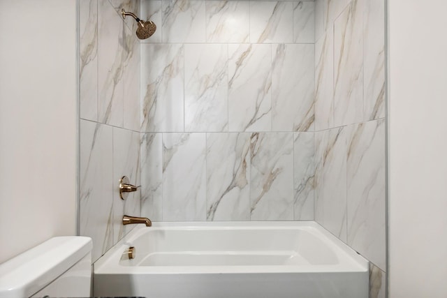 bathroom featuring toilet and tub / shower combination