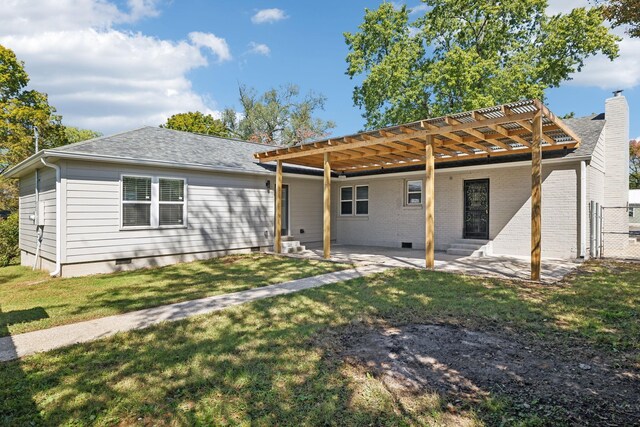 rear view of house with entry steps, a lawn, crawl space, a patio area, and brick siding