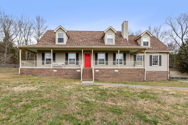 view of front facade featuring covered porch, a shingled roof, a chimney, and a front yard