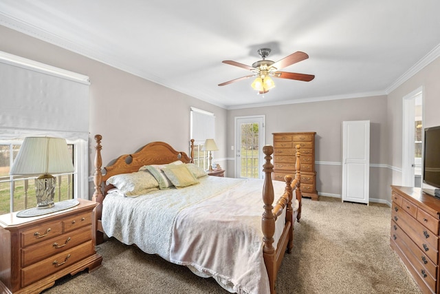 bedroom featuring crown molding, baseboards, a ceiling fan, and light colored carpet