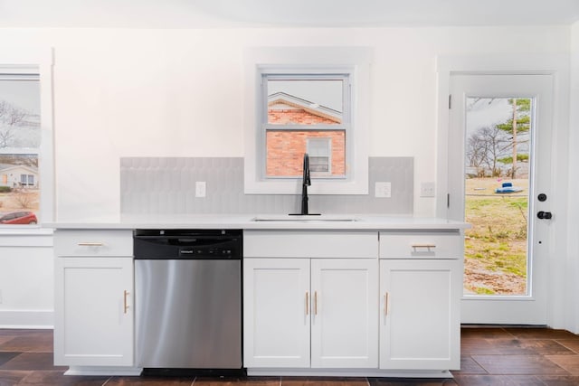 kitchen featuring a sink, white cabinetry, light countertops, and dishwasher