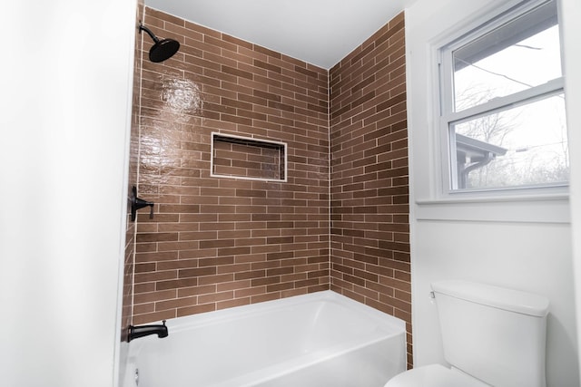 bathroom with toilet and washtub / shower combination