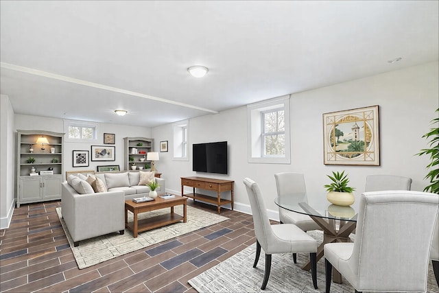 living area featuring wood finish floors and baseboards