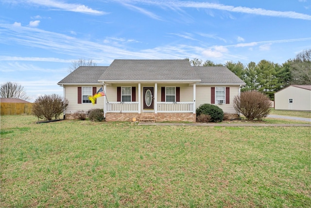 ranch-style home with covered porch and a front lawn