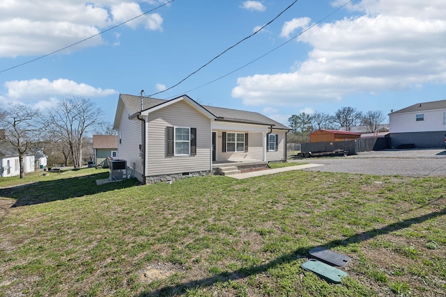 exterior space featuring crawl space and a yard