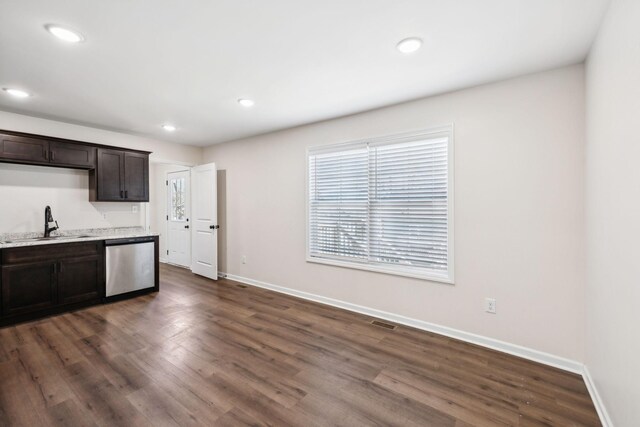 kitchen featuring a sink, visible vents, baseboards, dark brown cabinets, and dishwasher