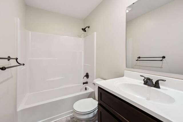 bathroom featuring shower / washtub combination, vanity, and toilet