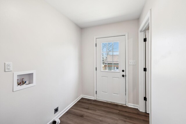 entryway featuring baseboards and dark wood-type flooring