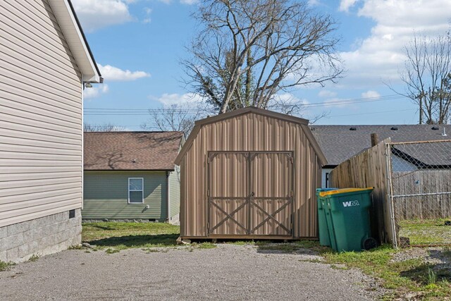 view of shed with fence