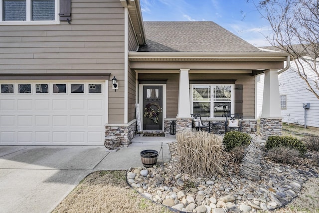 doorway to property with a porch, a garage, a shingled roof, stone siding, and driveway