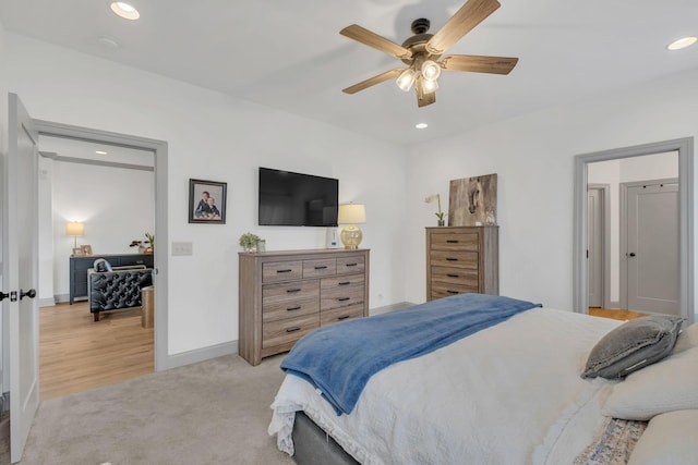 bedroom featuring recessed lighting, baseboards, a ceiling fan, and light colored carpet