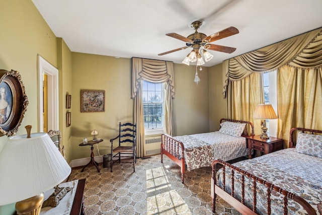 bedroom featuring ceiling fan and baseboards