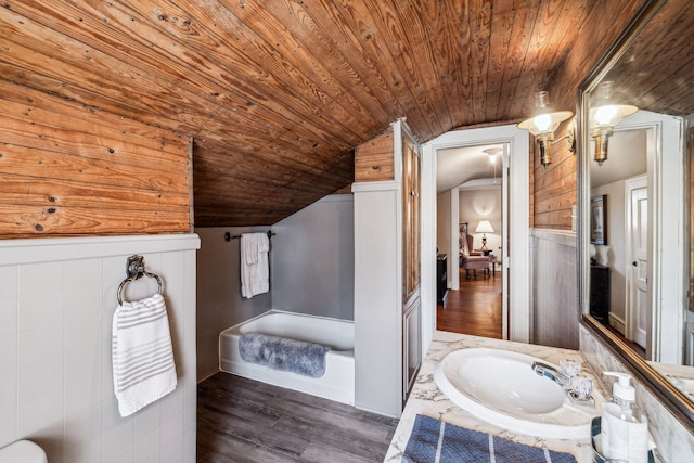 full bathroom with wooden ceiling, wood finished floors, vanity, vaulted ceiling, and a bath