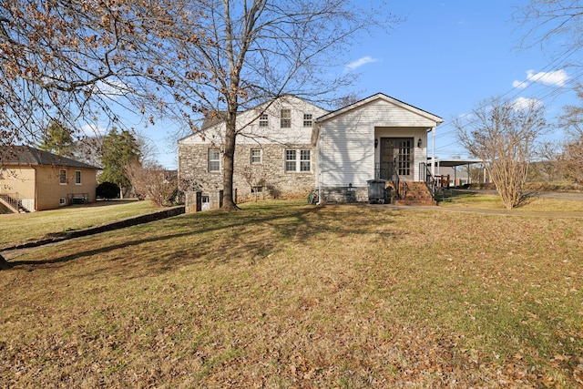 view of front of home featuring a front yard and stone siding