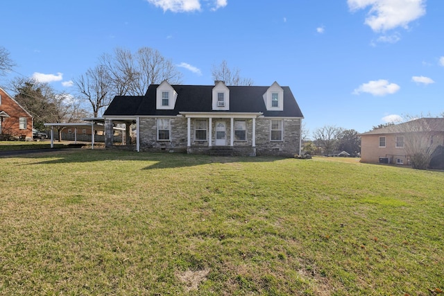 new england style home featuring stone siding and a front yard