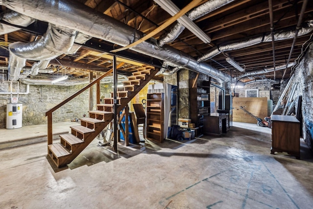 unfinished below grade area with water heater and stairs