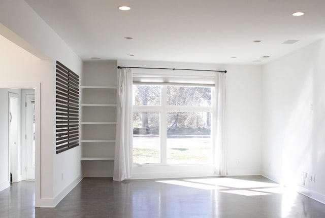 interior space featuring recessed lighting, dark wood finished floors, and baseboards