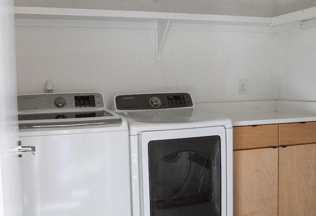 laundry room with separate washer and dryer