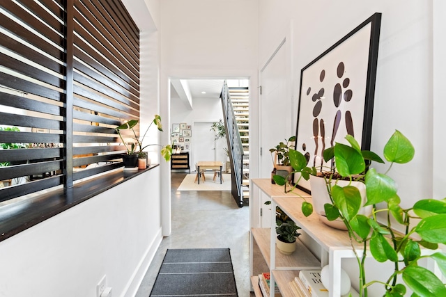 corridor with concrete flooring