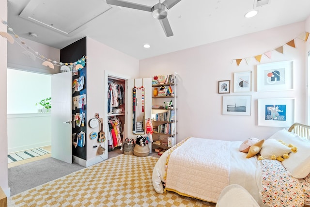 bedroom with ceiling fan, a closet, recessed lighting, and light colored carpet