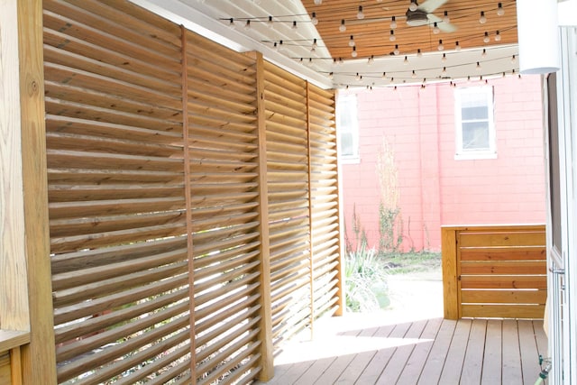 exterior space featuring ceiling fan and wood finished floors