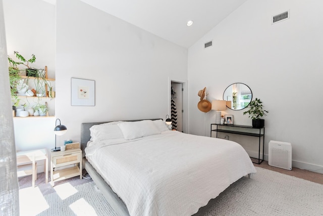 bedroom with light carpet, high vaulted ceiling, baseboards, and visible vents