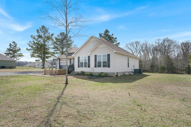 view of front of property with crawl space, central AC unit, and a front lawn