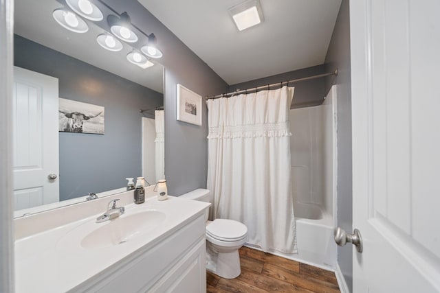 full bath with toilet, shower / bathtub combination with curtain, wood finished floors, and vanity