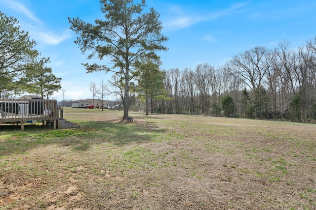 view of yard with a wooden deck