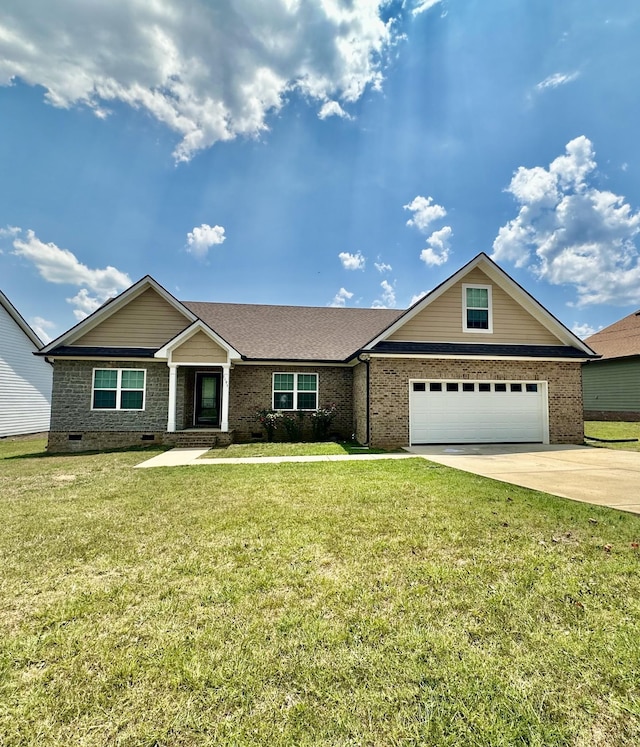 view of front facade with a front yard, crawl space, brick siding, and driveway