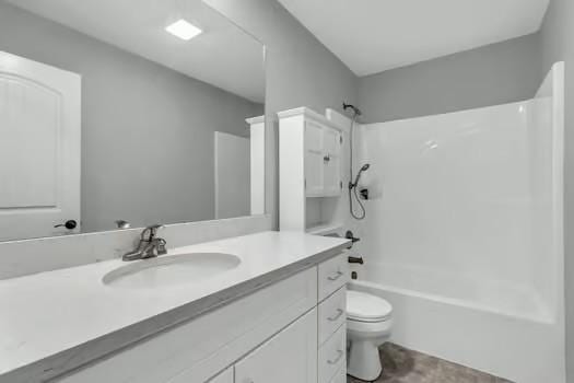 bathroom with toilet, washtub / shower combination, and vanity