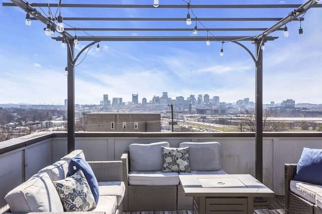 balcony featuring a view of city and a pergola