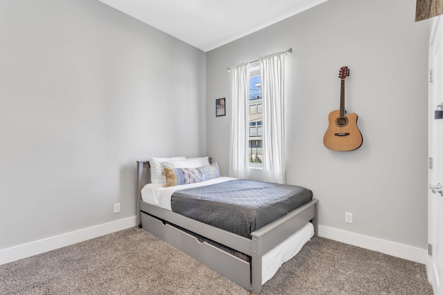 bedroom with carpet and baseboards