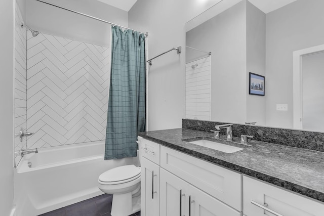 full bath with vanity, toilet, and shower / bath combo with shower curtain