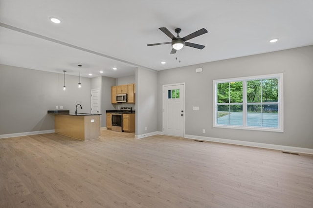 348 Welchwood Dr, Clarksville, TN 37040 - unfurnished living room with baseboards, recessed lighting, ceiling fan, and light wood-style flooring