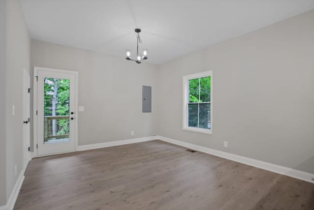 348 Welchwood Dr, Clarksville, TN 37040 - spare room with a chandelier, baseboards, wood finished floors, and electric panel