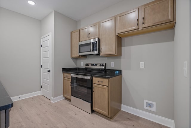 348 Welchwood Dr, Clarksville, TN 37040 - kitchen with light wood-style flooring, stainless steel appliances, baseboards, light brown cabinetry, and recessed lighting
