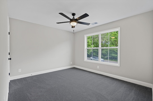 348 Welchwood Dr, Clarksville, TN 37040 - spare room with baseboards, visible vents, dark carpet, and a ceiling fan